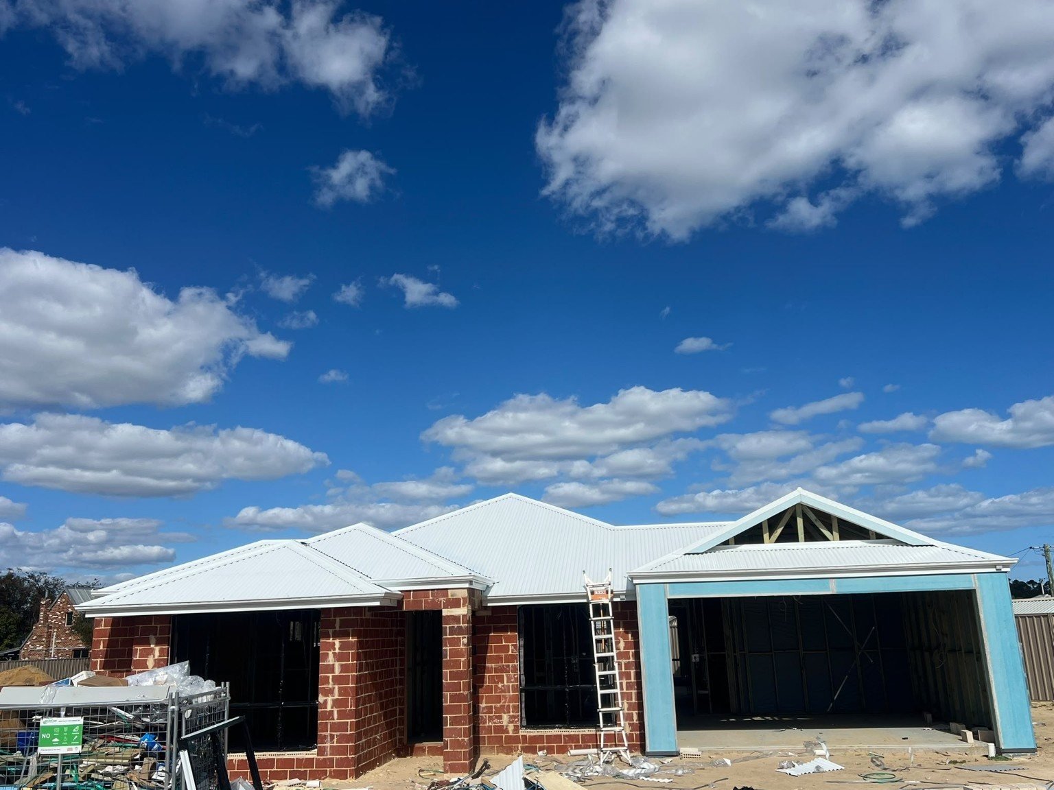 Completed white metal roof on new home